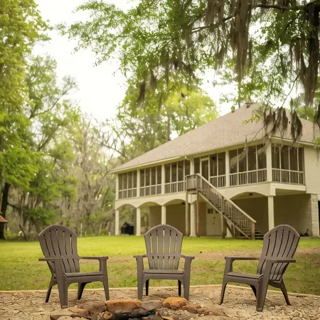 Elegant WATERFRONT home with private boat ramp/dock, elevator, & unmatched view!