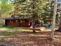 Beautiful log cabin on a private wooded lot