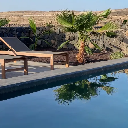 An architectural oasis with large swimming pool, along a breath-taking scenery.