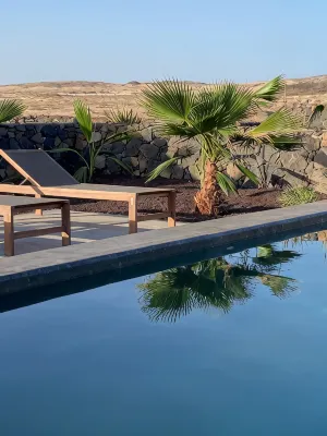 An architectural oasis with large swimming pool, along a breath-taking scenery.