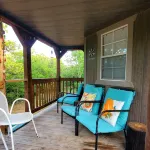 Cozy tiny cabin nested in the trees in a lake community, peaceful countryside.