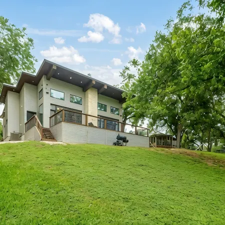 Modern River Home on 1/2 Acre with 101' of Private River Frontage.