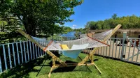Spacious 4-bedroom waterfront house in Sylvan Beach with private yard and dock.