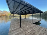 Modern lakefront cabin nestled in the piney woods of East Texas. Pet Friendly! Hotels in Camp County