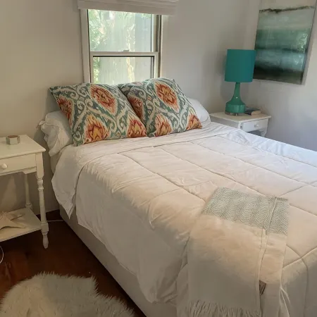 Bright airy Fair Harbor home with ocean views steps from the soft sandy beach