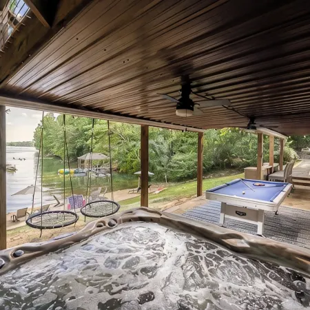 Lakefront Private Cove Retreat w/ Sandy Beach, Dock, Hot Tub + Boat & Ski Option