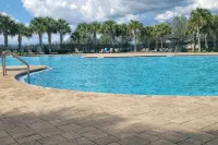 Cozy 4-bedroom house in Davenport- Haines City with WiFi, AC, Game Room, Screened Lanai - 3-Star