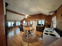 Charming 2-bedroom cabin sits on 2.5 acres on Hubbard Lake.