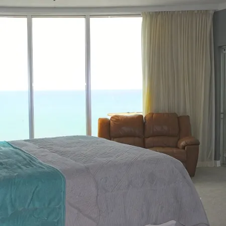 Floor to Ceiling Windows Overlook the Gulf of America's Pristine White Beaches