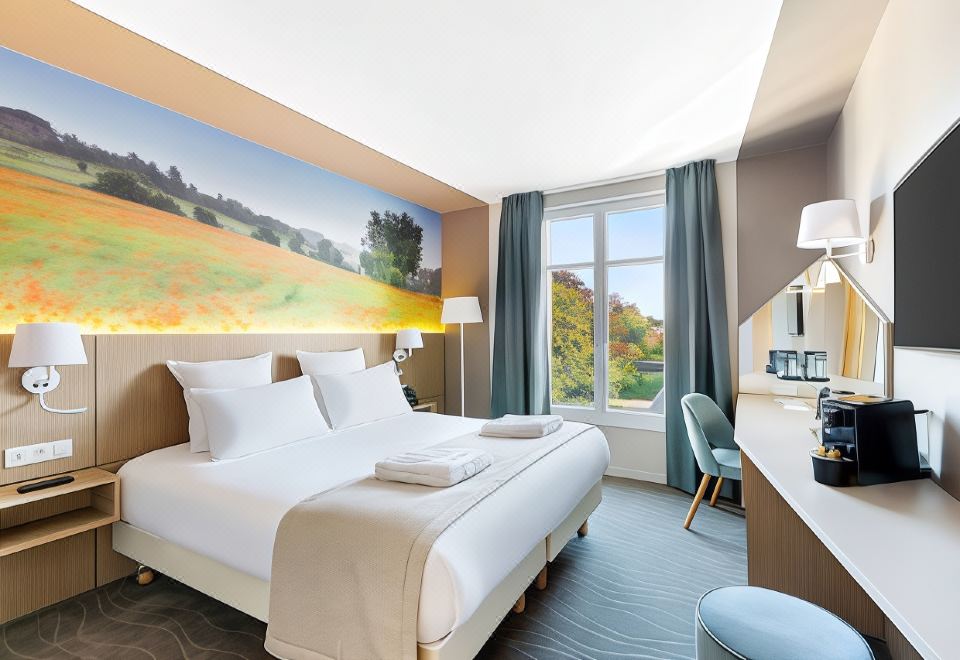 a modern hotel room with a large bed , white bedding , and a panoramic view of the countryside through a window at Best Western le Beffroi