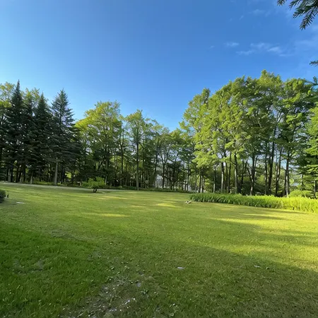 Spacious five-bedroom home off Back Lake with direct trail access on Spooner Rd