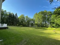 Spacious five-bedroom home off Back Lake with direct trail access on Spooner Rd
