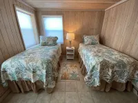 Pink Bikini Island Cottage with a dock on Black Sound - 4-Star