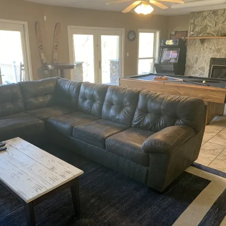 Lakehouse with covered dock, slide, and outdoor kitchen! Close to I-75, trails.