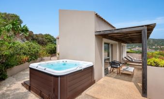 Baia Chia Laguna Resort, Curio Collection by Hilton