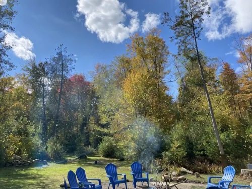 The perfect ADK log cabin getaway on 4 acres and 5 min. to town!