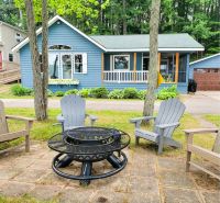 NEW! Renovated Bungalow steps from Lake Tomahawk - King Bed, Dock Space, Firepit