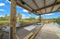 Charming Waterfront Home - Dock Access - Fishing Retreat - Pool - AC - King Bed! - balcony