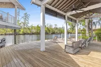 Luxury riverfront home w/ pool, fishing dock, & boat house w/ lift ! Sleeps 14