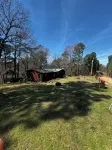 Quiet cabin in the woods w/ access to pools, river, & lakes in gated community!!