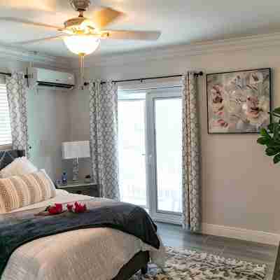 Entire Condominium Home away from Home with Pool, Near Beach Rooms