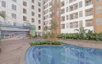 Grey Toned 1BR Apartment Tamansari Skylounge Makassar By Travelio - Apartments