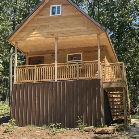 Cowboy Cabin is Nestled in a Little Woodland Village – Playground, Pond and More