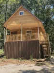 Cozy Tiny Cabin Nestled in a Little Woodland Village – Playground, Pond and More