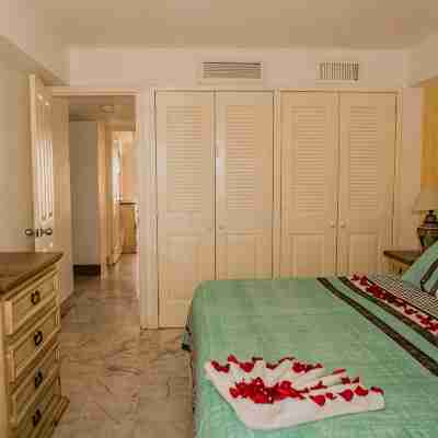 Beachfront 2 Bedroom Condo at Tesoro Hotel & Condo Resort Rooms