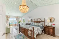 Waterfront home with dock, heated pool, & spectacular views- walk/bike downtown!