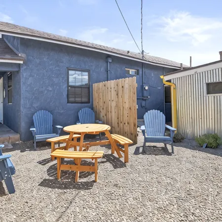 Downtown Blue Bungalow w/Fully Fenced Yard, AC, W/D, 3 Smart TVs, Den, Fast WiFi