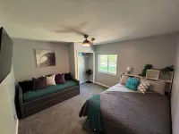 Spacious home near Torch Lake w/custom back patio, steps away from public access - 4-Star