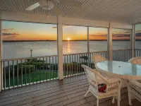 Large home on private penninsula with waterfront and views on three sides.
