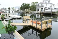 Unique waterfront home, Hot Tub, private boat dock,  walk to beach, pet friendly