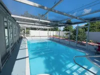 Quiet Pool Haven: 4BR - 9PPL, AC, WiFi, and Beaches Nearby
