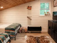 Modern mountain- inspired monoslope home located in the beautiful Northwoods Hotels in Round Lake