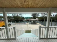 NEW RENTAL!!! Conch Heaven is a four bedroom house on a canal with a dock. - Wi-Fi