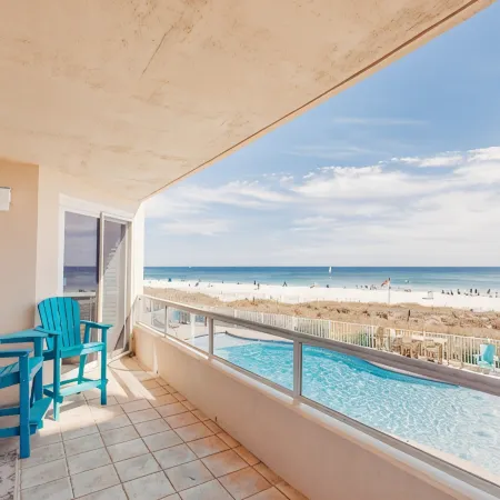 Luxurious 2nd floor beachfront condo w wrap-around balcony @ The Enclave
