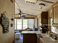 Parkmodel cabin w screened porch in campground on bike trail.