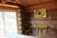 Authentic log in the heart of the pine forest for 10 people - balcony
