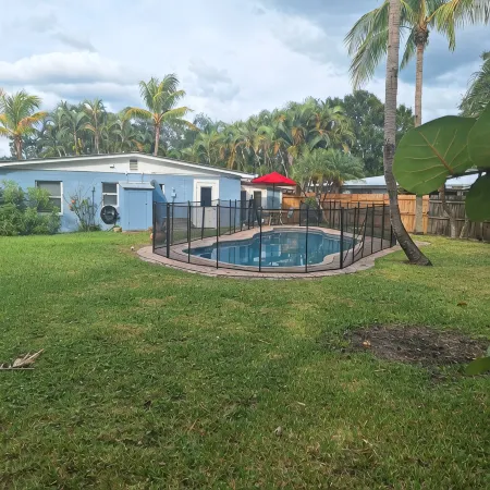 Lagoon shaped pool home with private back yard!