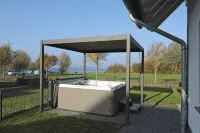 Vacation home directly on the lake, outdoor whirlpool and exclusive 20sqm wellness sauna - Homestays