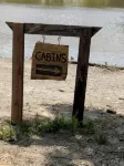 Big Mike's Cabin on the lake, next to ball diamonds nestled in 3 -cabin village