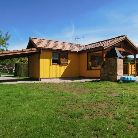 Fenced cottage rental with barbecue and children's play area