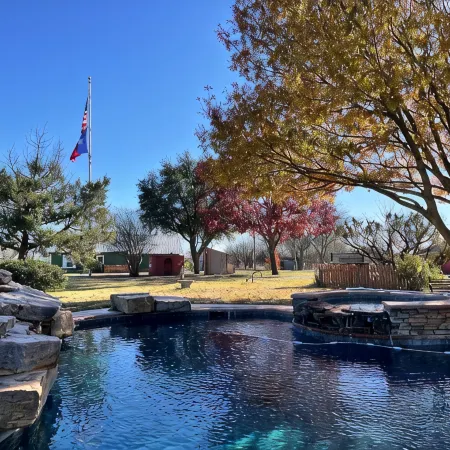 Cozy farmhouse w/pool. Central to museums, golfing, lakes, sports & shopping.