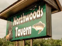 Modern mountain- inspired monoslope home located in the beautiful Northwoods Hotels in Round Lake