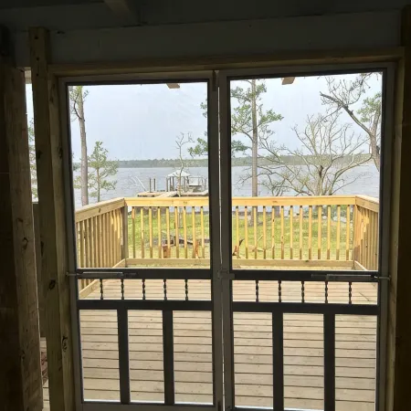 Secluded waterfront fishing cabin, boat dock, pier, sunsets, boat to beach