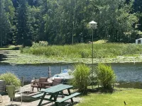 Cottage 3 is a charming 2 bedroom 25’ from your boat dock & Hamlin lake. Hotel a Hamlin Township