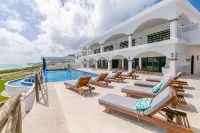 Brand New 12 Suite Villa  directly on the waters edge of the Caribbean Sea - Villas