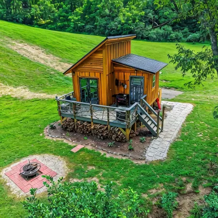 Tiny cabin sits by a bubbling, stocked creek. Pet friendly for a fee, hot tub